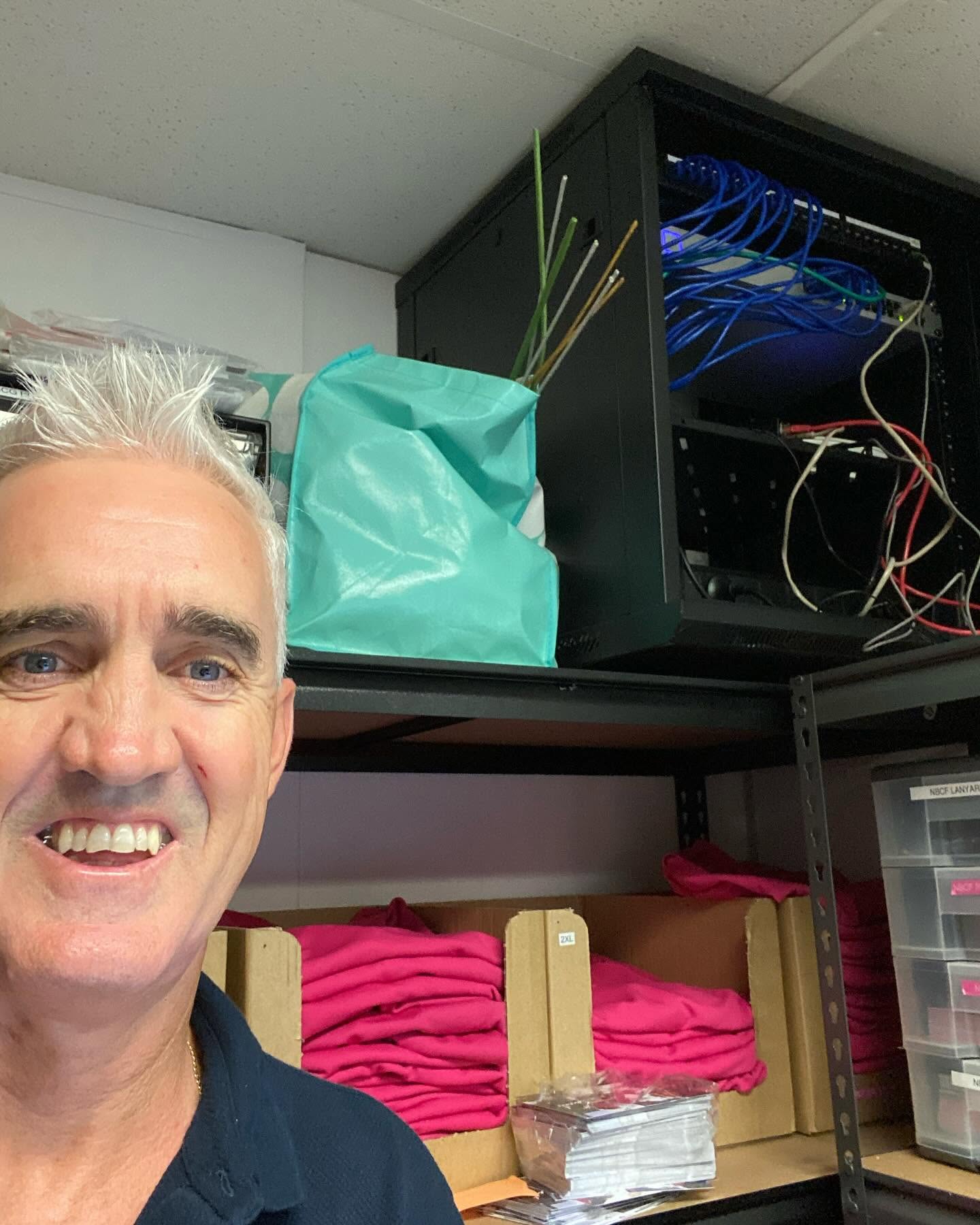 Ruben Alker on site at a customer's comms rack